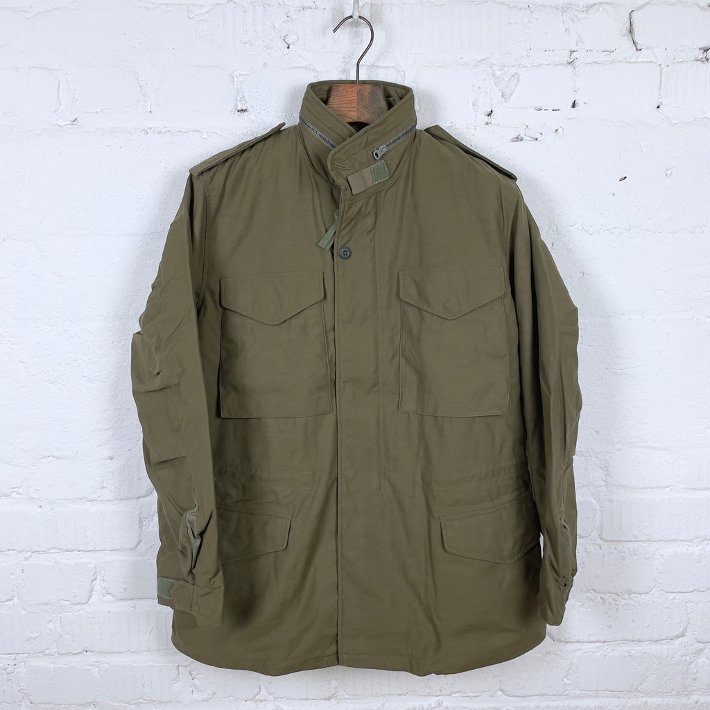 https://www.stuf-f.com/media/image/21/60/f5/buzz-ricksons-m-65-field-jacket-olive-drab-1.jpg