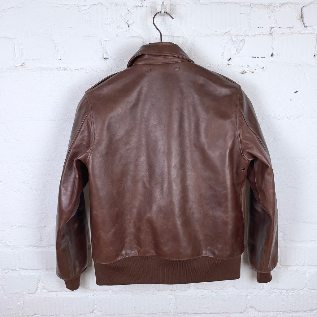 https://www.stuf-f.com/media/image/f4/e0/d7/double-helix-a2-flight-jacket-oiled-wax-leather-brown-2.jpg