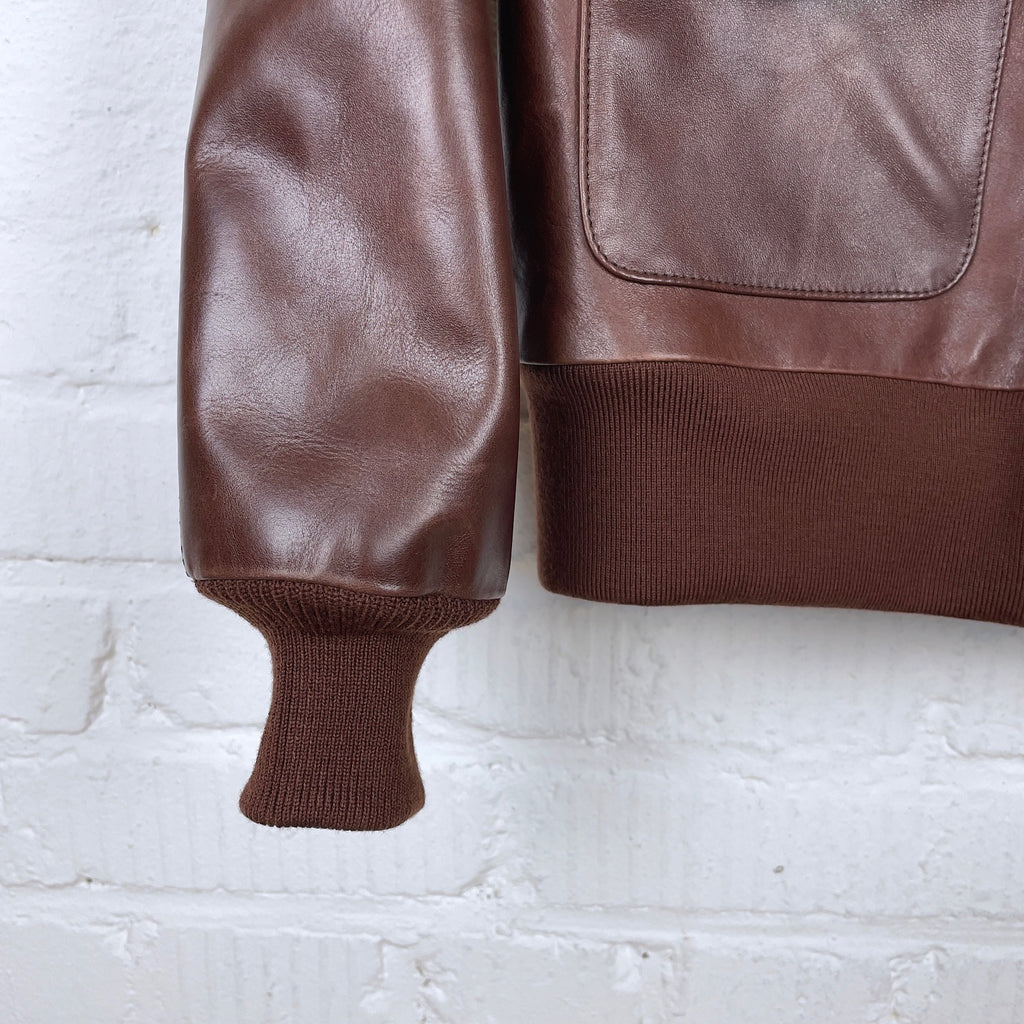 https://www.stuf-f.com/media/image/dc/9a/d8/double-helix-a2-flight-jacket-oiled-wax-leather-brown-3.jpg