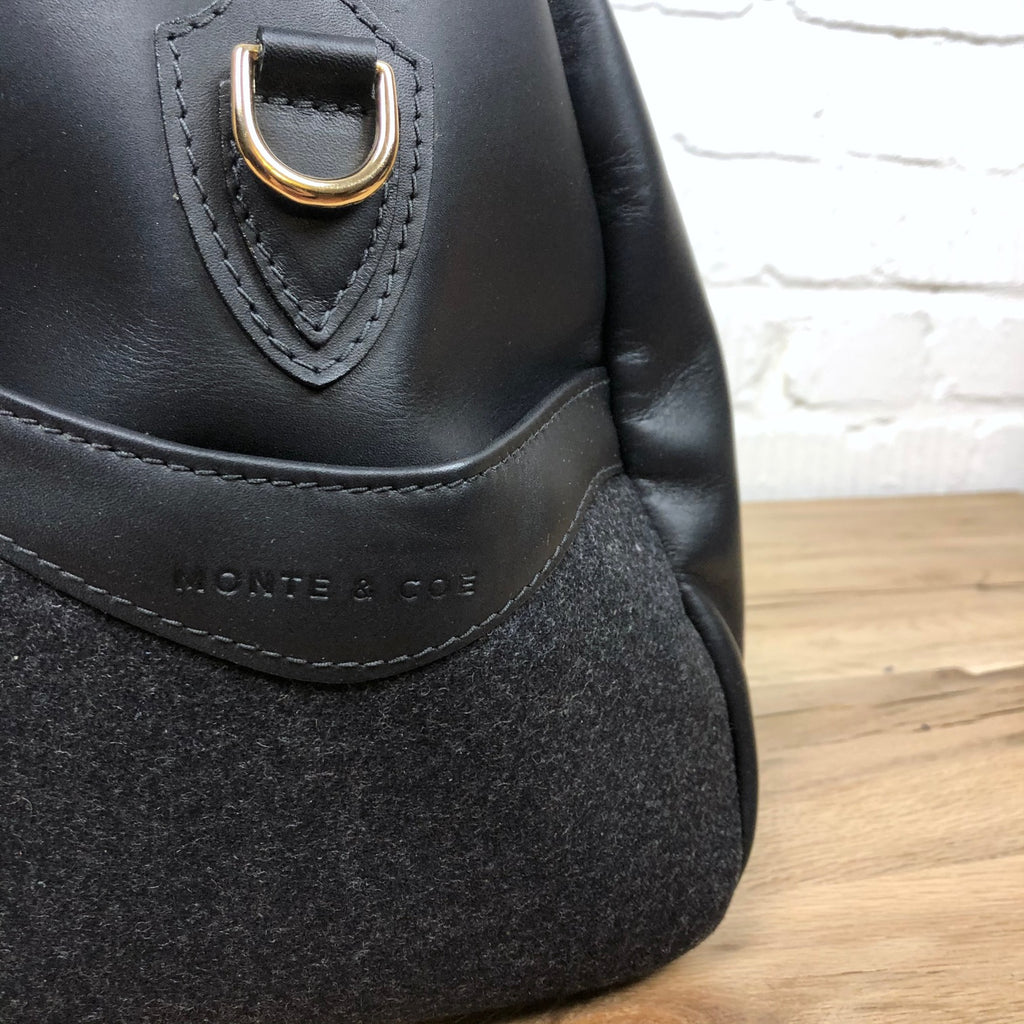 https://www.stuf-f.com/media/image/9e/62/69/monte-and-coe-leather-weekender-bag-black-4.jpg