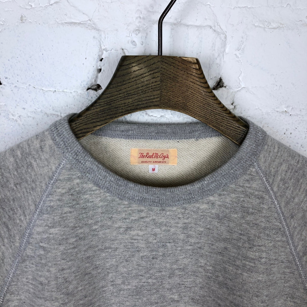 https://www.stuf-f.com/media/image/f9/9c/ef/the-real-mccoys-9oz-loopwheel-raglan-sleeve-sweatshirt-grey-4.jpg