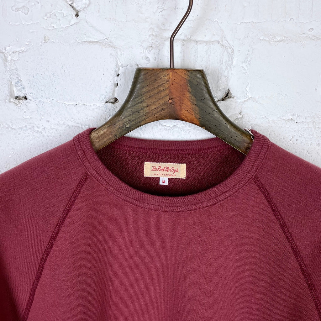 https://www.stuf-f.com/media/image/8e/a0/7f/the-real-mccoys-9oz-loopwheel-raglan-sleeve-sweatshirt-maroon-2.jpg