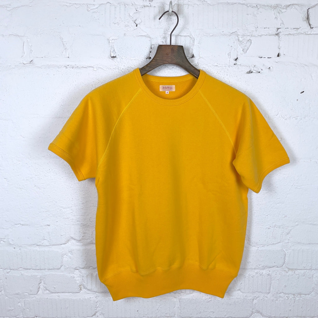 https://www.stuf-f.com/media/image/47/f7/6c/the-real-mccoys-9oz-loopwheel-short-sleeve-sweatshirt-yellow-1.jpg