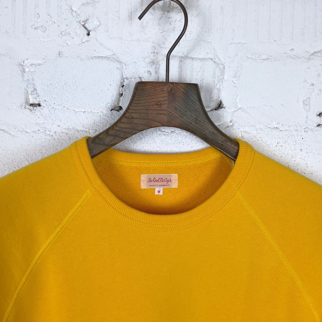 https://www.stuf-f.com/media/image/1a/dc/8a/the-real-mccoys-9oz-loopwheel-short-sleeve-sweatshirt-yellow-2.jpg