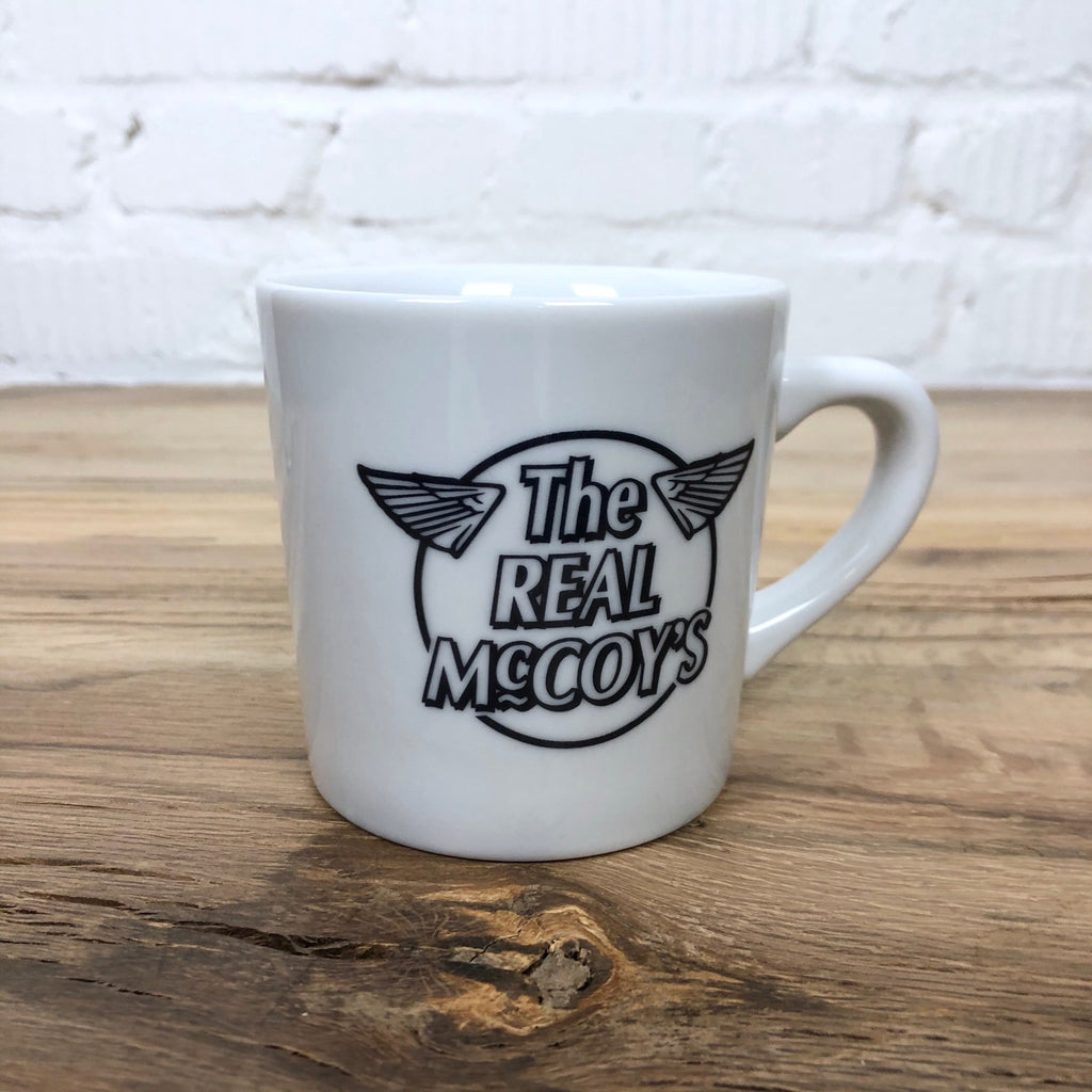 https://www.stuf-f.com/media/image/ca/2e/6e/the-real-mccoys-logo-mug-cup.jpg