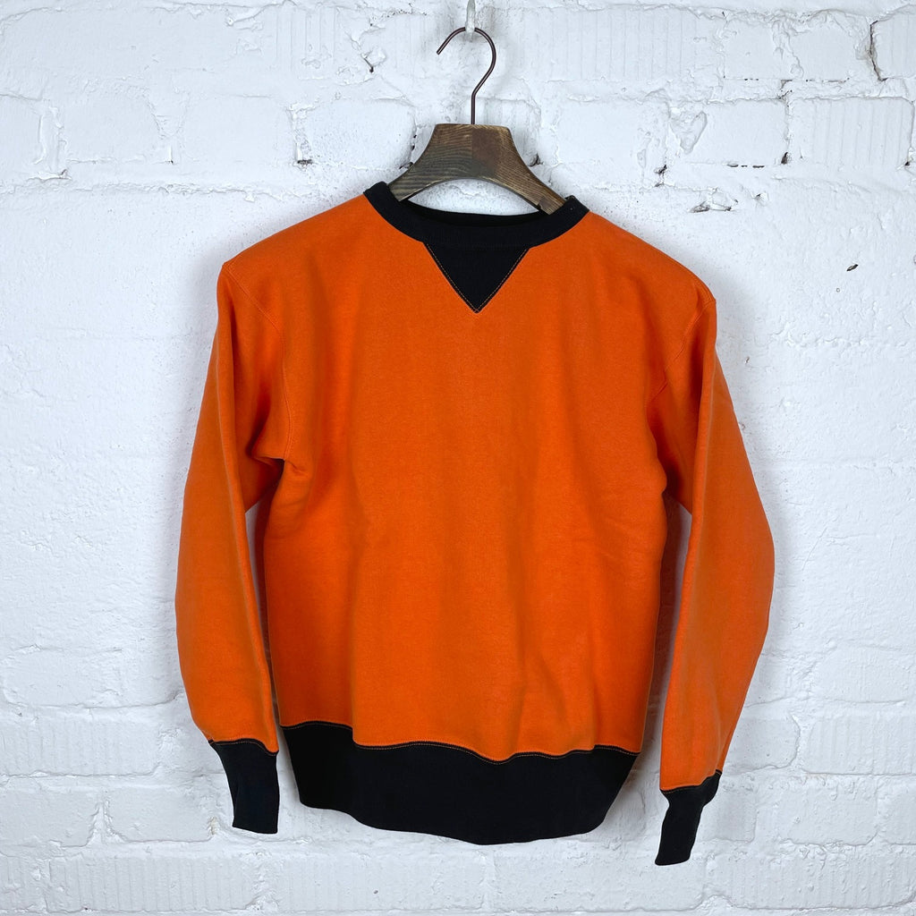 https://www.stuf-f.com/media/image/17/51/6a/the-real-mccoys-two-tone-sweatshirt-orange-black-1.jpg