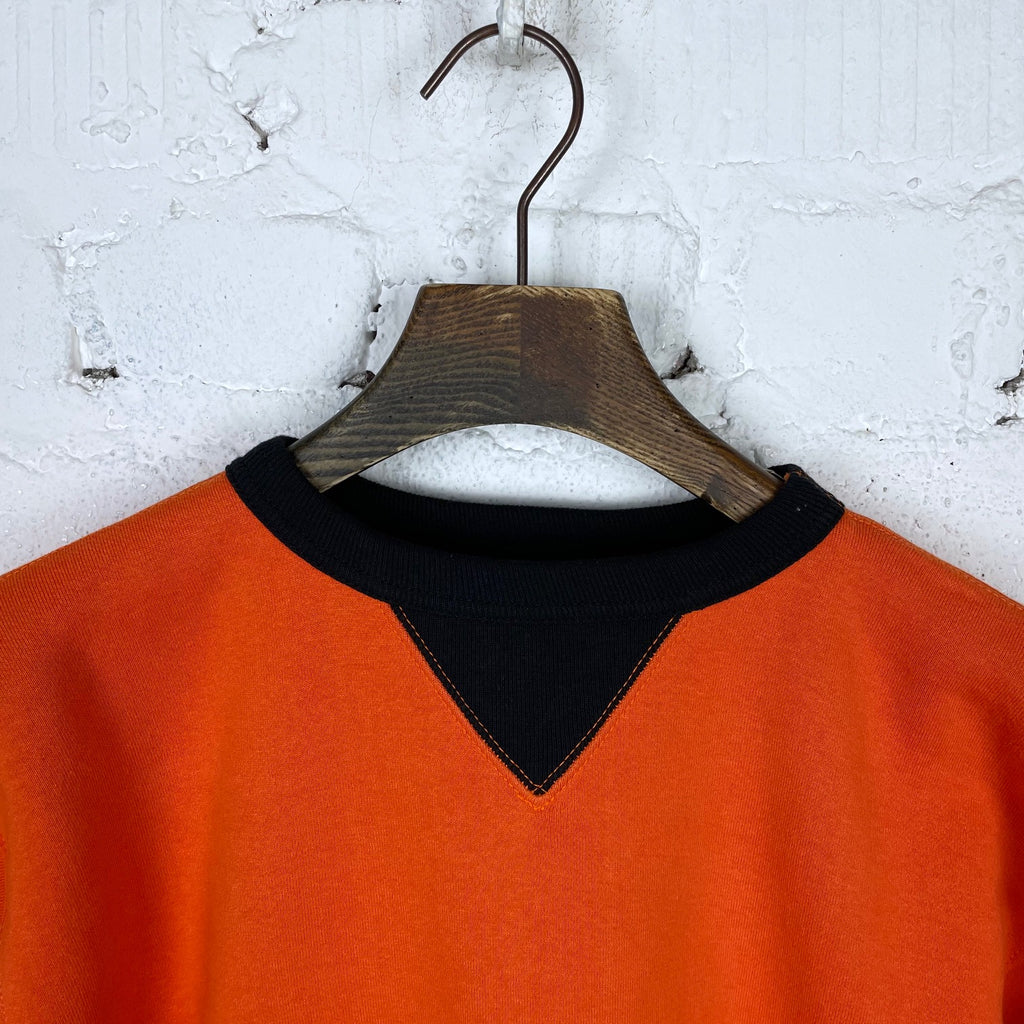https://www.stuf-f.com/media/image/77/df/f3/the-real-mccoys-two-tone-sweatshirt-orange-black-2.jpg